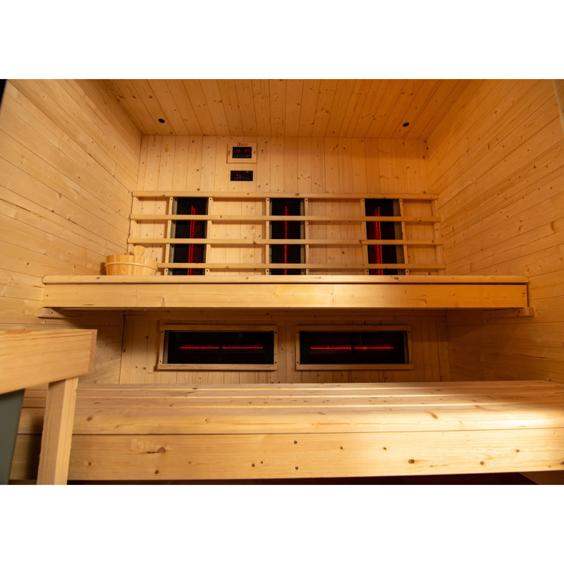 Infrared sauna with wooden interior and heating elements.
