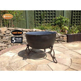 Gardeco Meredir Cast Iron Fire Bowl In Bronze In A Garden Setting | SKU: MEREDIR | Barcode: 5031599045511