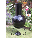 Back View Of Gardeco Sempra Large Black Chimalin AFC Chiminea In A Garden Setting | SKU: AFC-C21.75 | Barcode: 5031599044613