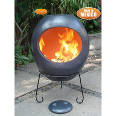 Gardeco Extra Large Ellipse Mexican Chiminea In Charcoal Grey Fired Up In A Garden Setting | SKU: C10.13 | Barcode: 5031599035024 | Weight: 29kg