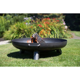 RedFire Salo Black Steel Fire Bowl With Burning Logs Inside In A Sunny Garden Setting | SKU: 411828 | UPC: 8718801853856