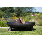 RedFire Salo Black Steel Fire Bowl With Burning Logs Inside In A Sunny Garden Setting | SKU: 411828 | UPC: 8718801853856
