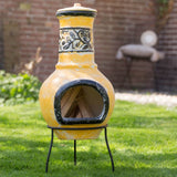 RedFire Soledad Clay Chiminea / Outdoor Fireplace In Yellow & Black In A Beautiful Sunny Garden Setting | SKU: 411835 | Barcode: 8718801854730