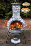Gardeco Extra Large Olas Mexican Chiminea In Bluey Grey With Burning Logs Inside | SKU: C8O.07 | Barcode: 5031599046259