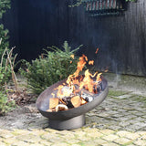 Esschert Design Black Steel Sloping Fire Bowl With Burning Logs In A Garden Setting | SKU: 422496 | UPC: 8714982142727